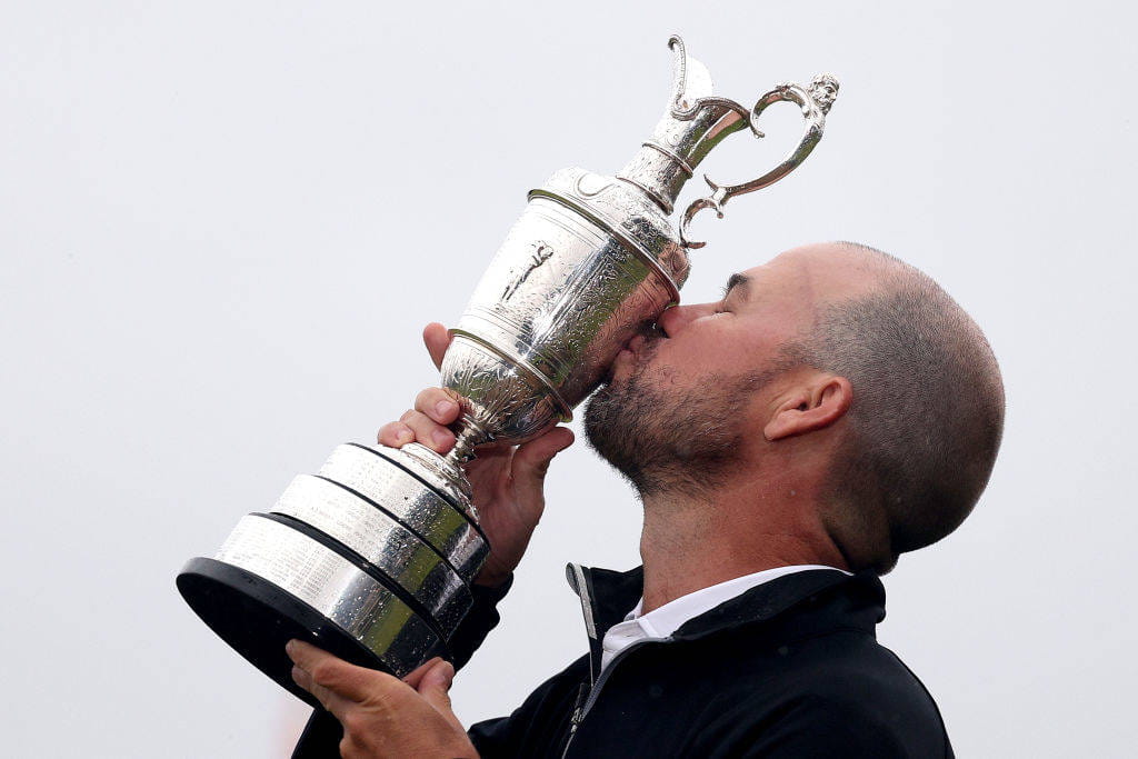 Brian Harman, the Champion Golfer of the Year, kisses the Claret Jug